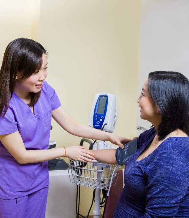 Nurse taking blood pressure